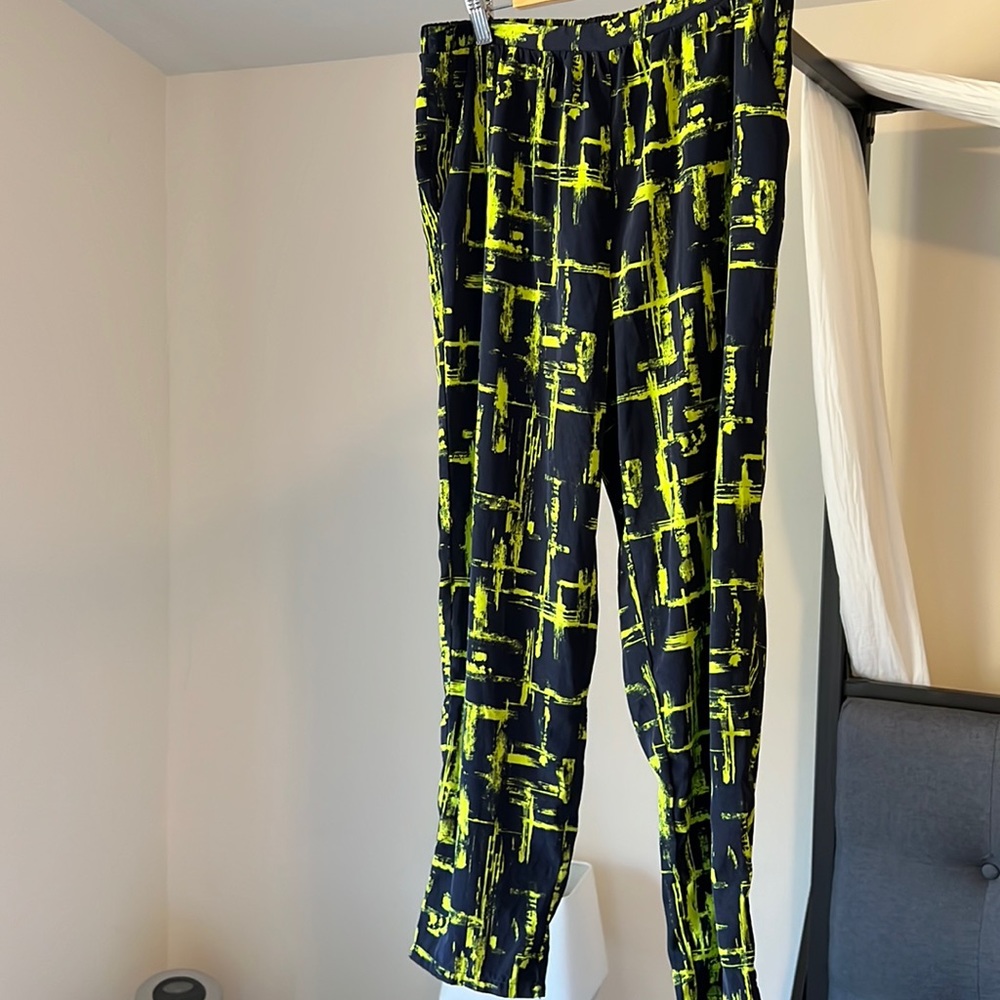 Cropped satin pants with blue and lime green patterns